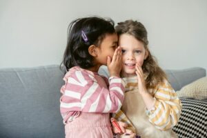 children whispering