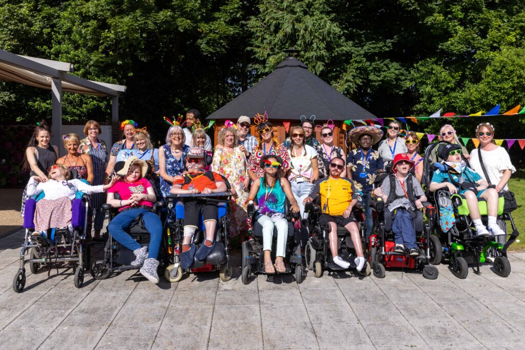 Young adults, staff, families and volunteers at Jestival