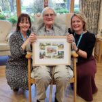 Hospice founder unveils commissioned print to celebrate charity’s milestone