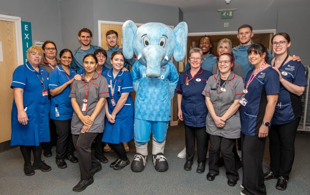 CCFC players with The Myton Hospices staff members