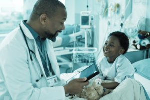 Doctor and child patient in a hospital talking.
