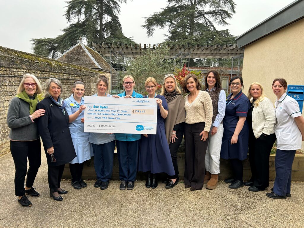 Dedicated fundraising group continues to raise thousands for Sue Ryder hospice The Angel Commitee with staff from Sue Ryder Thorpe Hall Hospice
