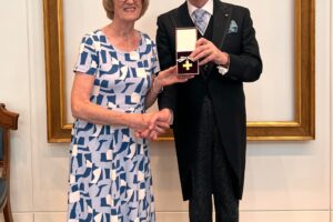 Bobbie Nichols being awarded by Lord Lingfield, President of the League of Mercy