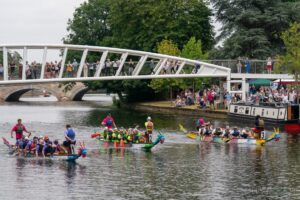 Three of the teams passing under a bridge
